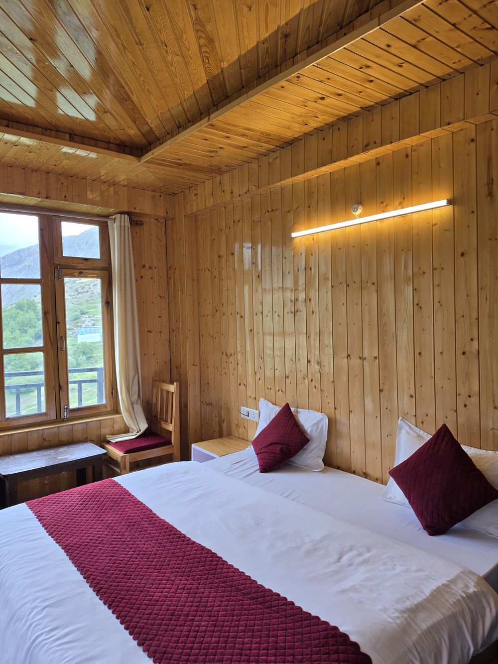 Spacious pine family room with valley window at Hotel Snow Hills, Gondhla